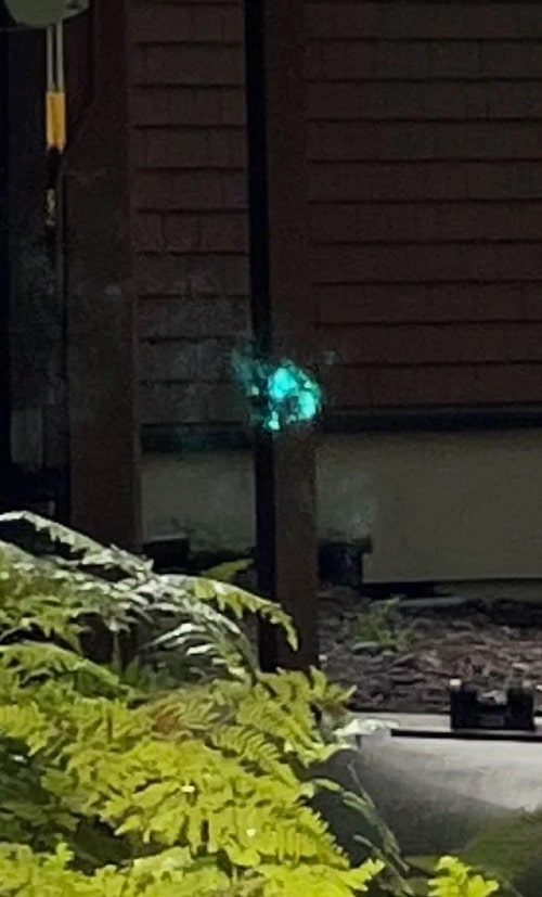 Green orb outside a home